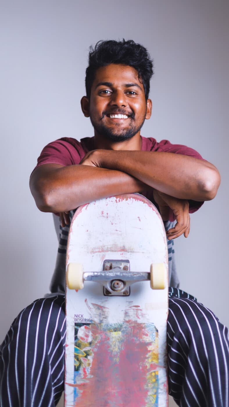 WeSkateCo community member holding a skateboard