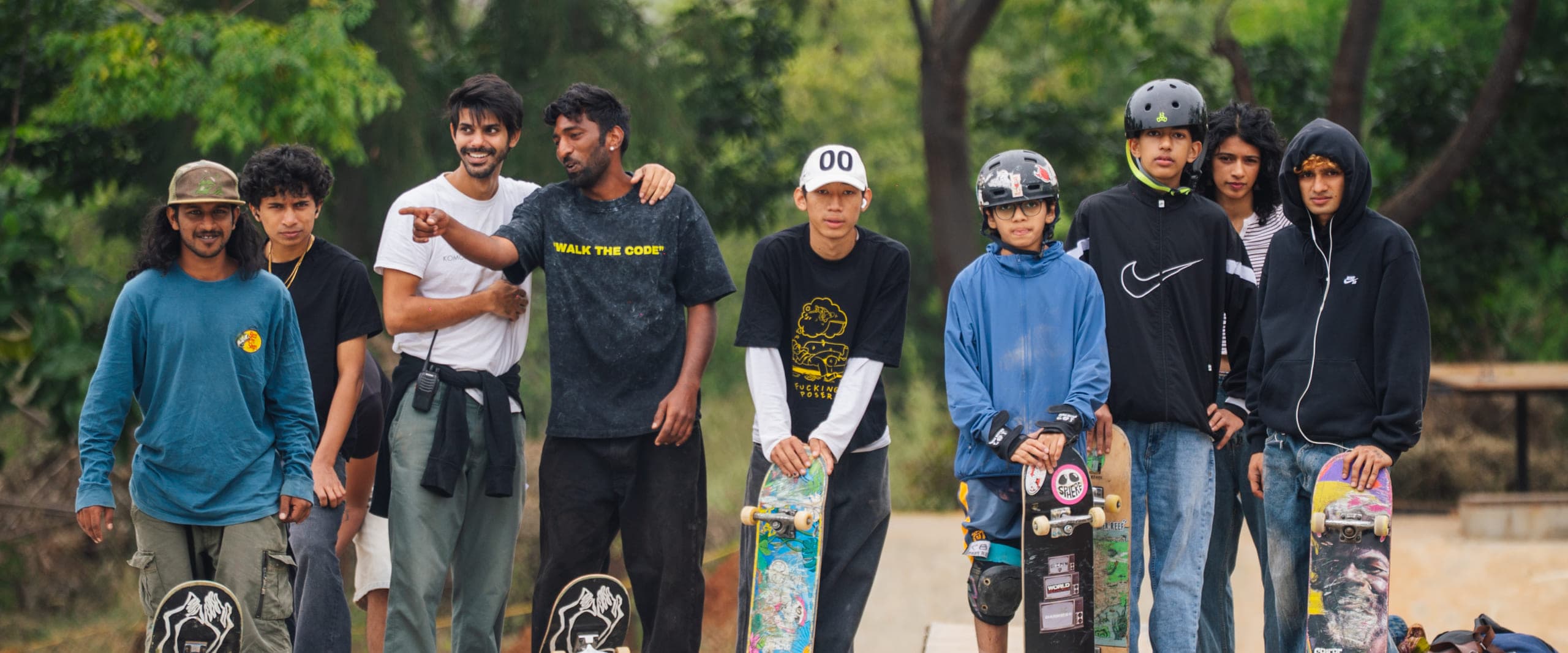 WeSkate Academy riders with their skateboards at the park