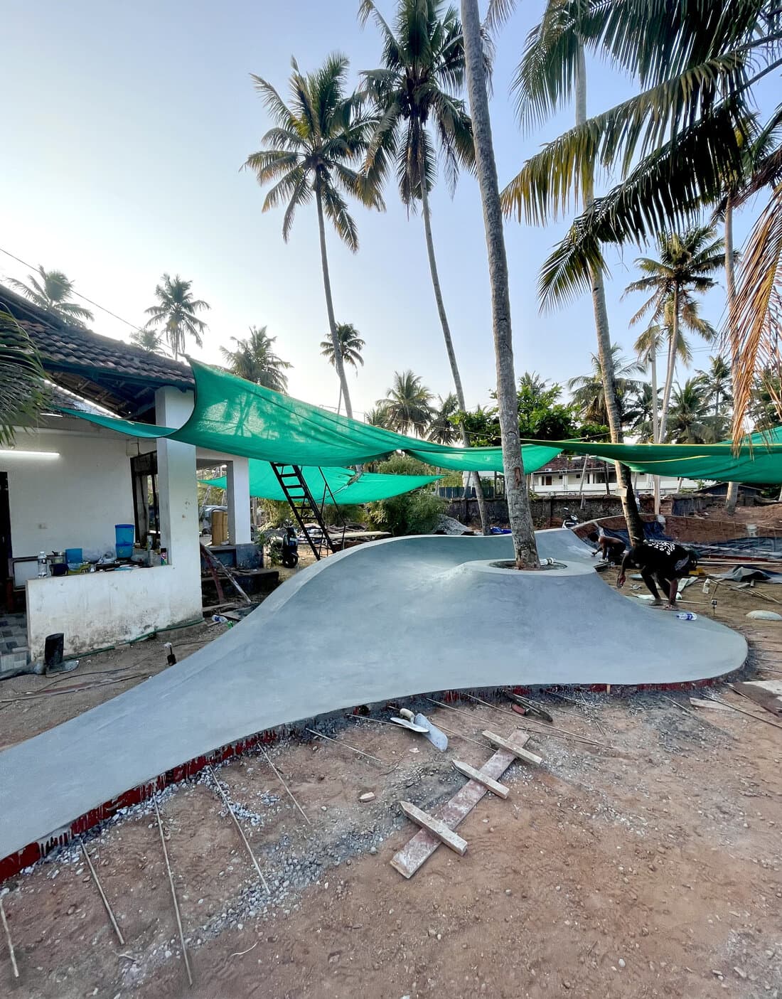 Freshly poured concrete bank at a skatepark under construction