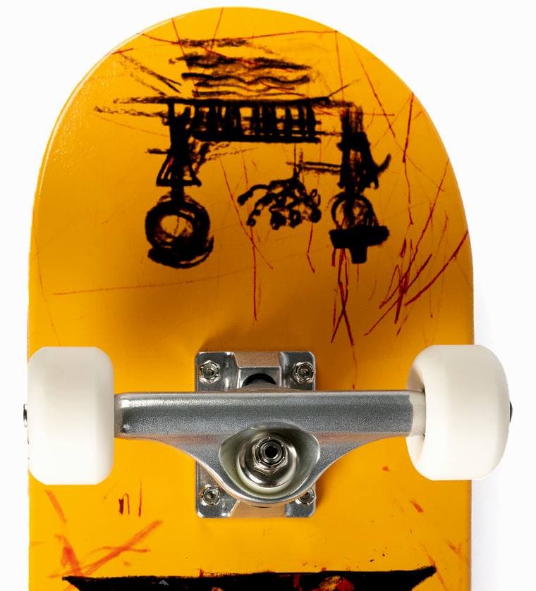 A skateboard truck seen from directly above with the deck level, the axle square across the board