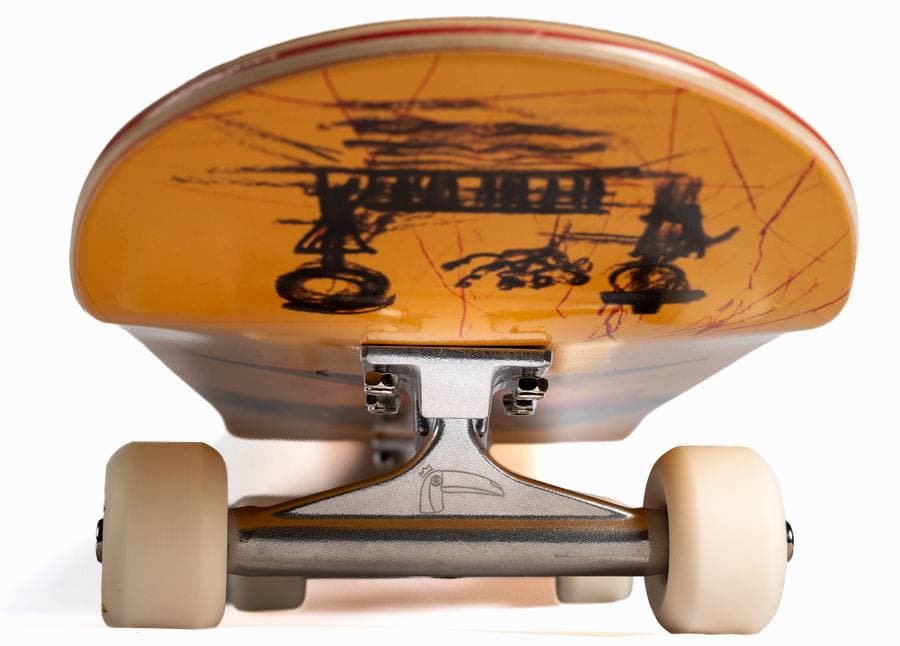 A skateboard truck seen from behind with the deck level, both bushings at rest